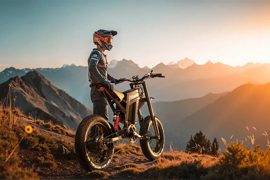 Side profile shot of rider in full gear standing beside Shengmilo S900 heavy-duty off-road e-bike on mountain ridge at golden sunset.